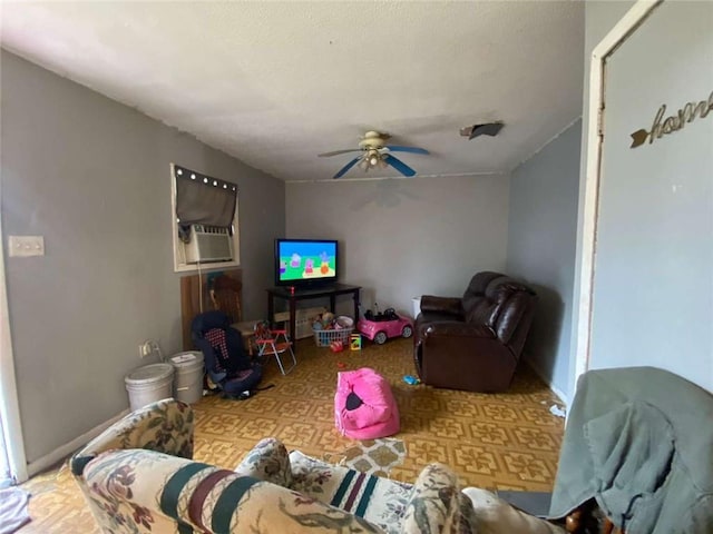 living room with ceiling fan and cooling unit