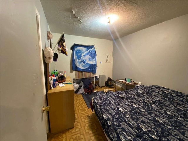 bedroom with a textured ceiling