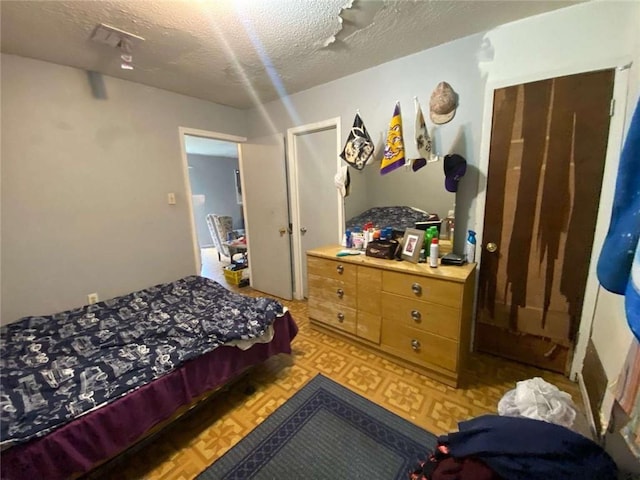 bedroom featuring a textured ceiling