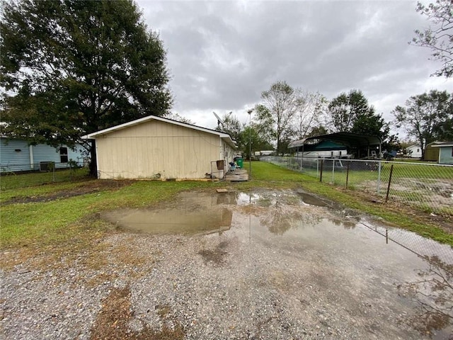 view of side of home with a carport