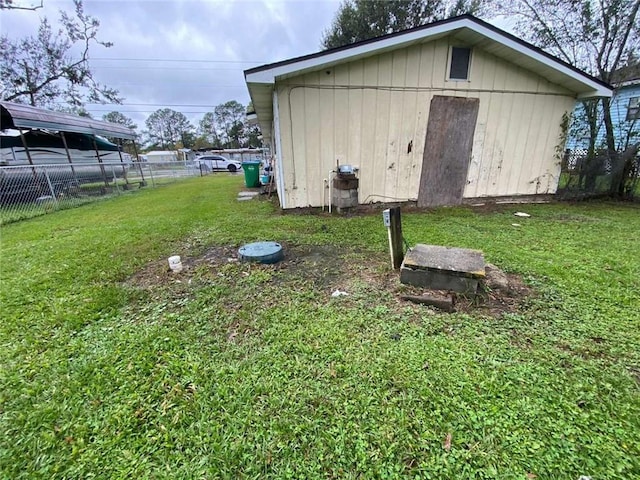 view of outdoor structure featuring a lawn