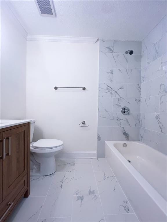 full bathroom featuring toilet, vanity, and tiled shower / bath