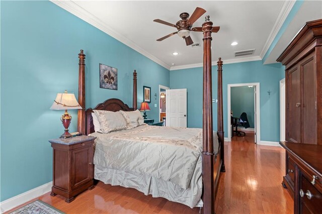 bedroom featuring ceiling fan, light hardwood / wood-style floors, and ornamental molding