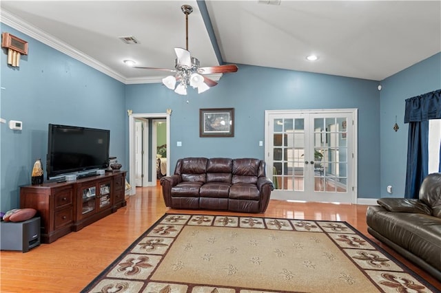 living room with ceiling fan, french doors, crown molding, lofted ceiling, and light wood-type flooring