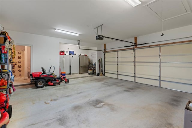 garage with a garage door opener and freestanding refrigerator