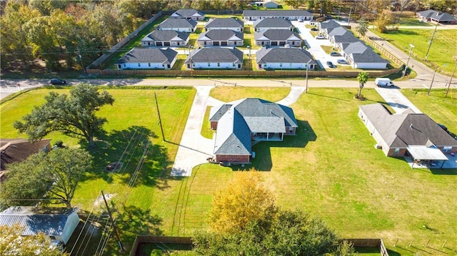 birds eye view of property with a residential view