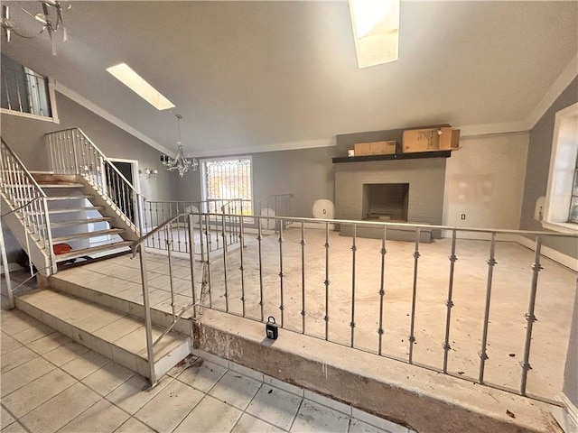 interior space with ornamental molding and a chandelier