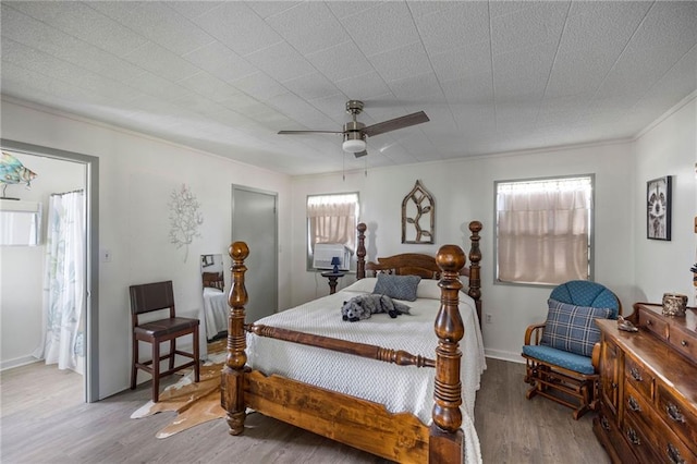 bedroom featuring ceiling fan and hardwood / wood-style floors