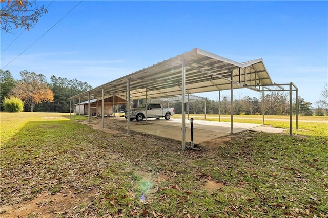 view of parking featuring a carport and a yard