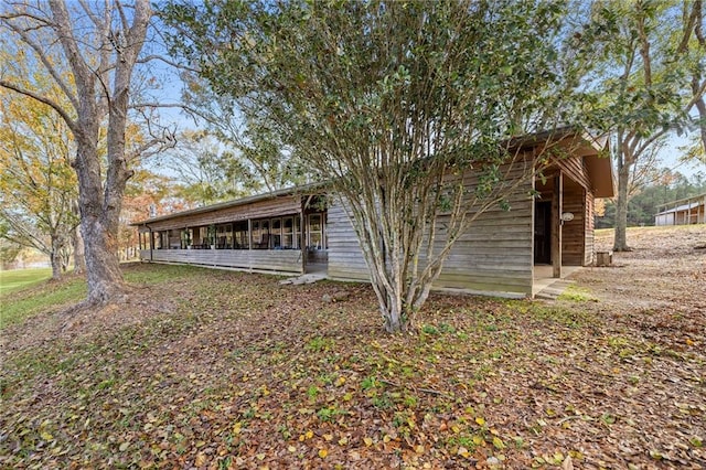 exterior space featuring a sunroom