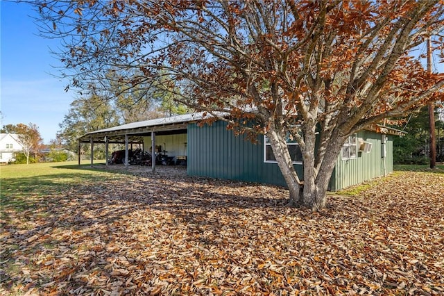 view of side of home featuring a carport