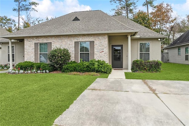 bungalow-style house with a front yard