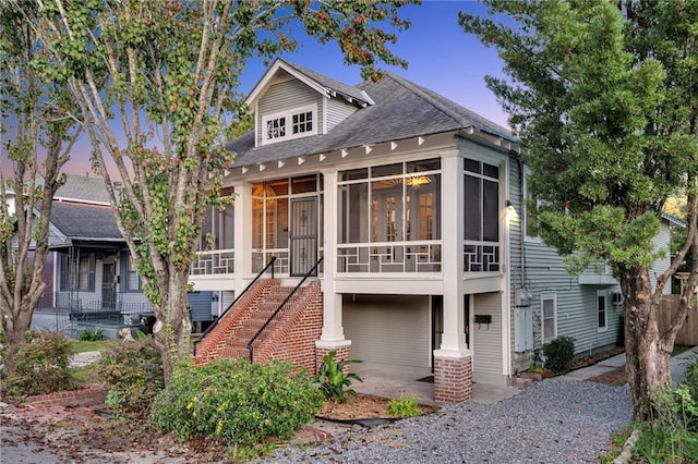 view of front of home with a sunroom