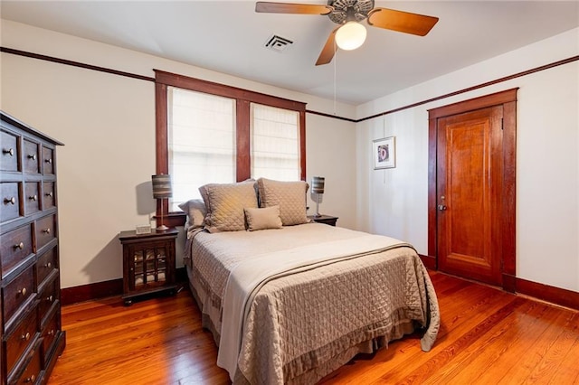 bedroom featuring hardwood / wood-style floors and ceiling fan