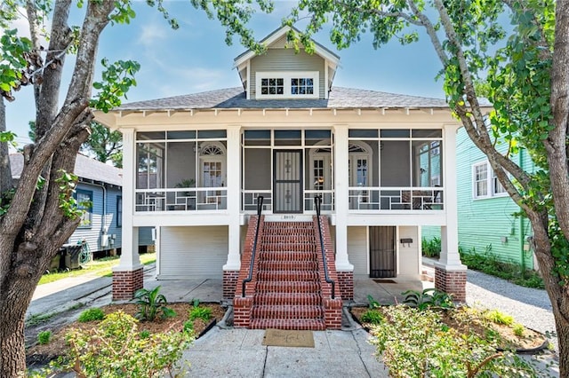 view of front of home with a sunroom