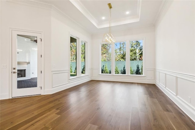 interior space featuring crown molding, dark wood-type flooring, and a notable chandelier