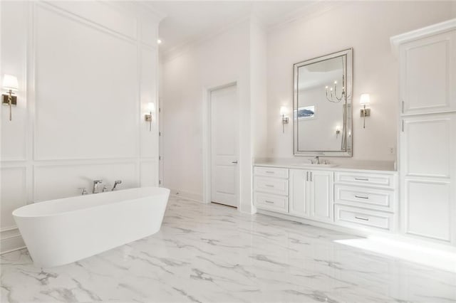 bathroom with a washtub, vanity, and ornamental molding