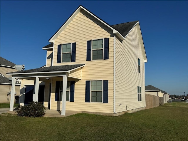 view of front facade featuring a front lawn and covered porch