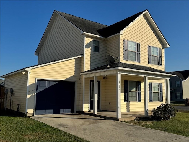 view of front of property with covered porch and a garage