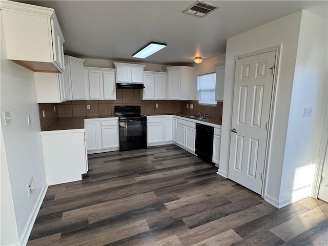 kitchen featuring black appliances, sink, tasteful backsplash, dark hardwood / wood-style flooring, and white cabinetry