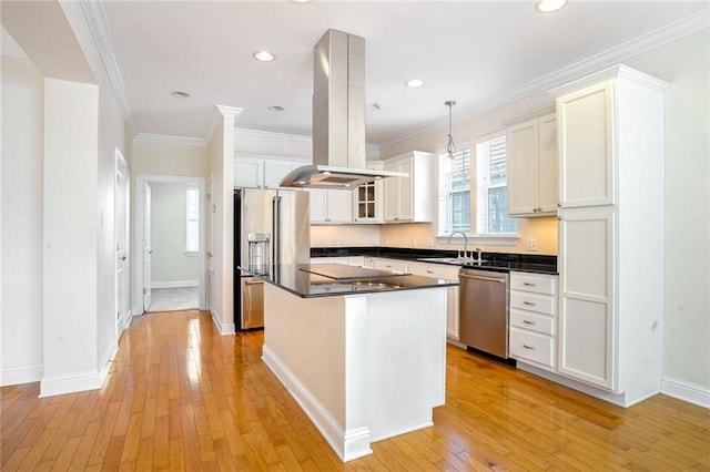 5913 Catina St, New Orleans, LA 70124 - kitchen with stainless steel appliances, island exhaust hood, dark countertops, a center island, and light wood-style floors