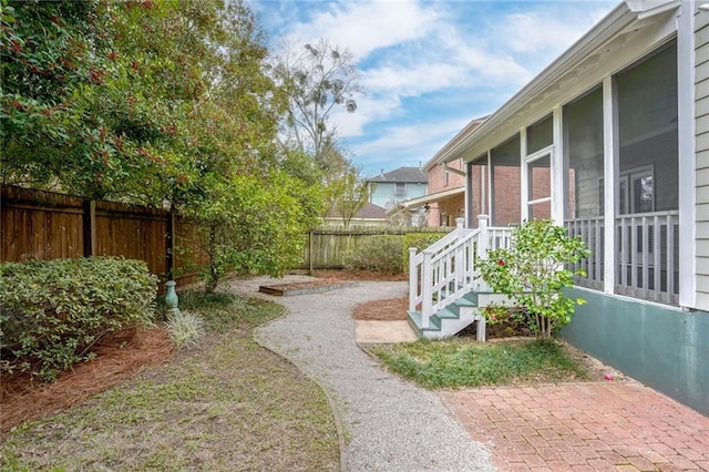 view of yard with a sunroom