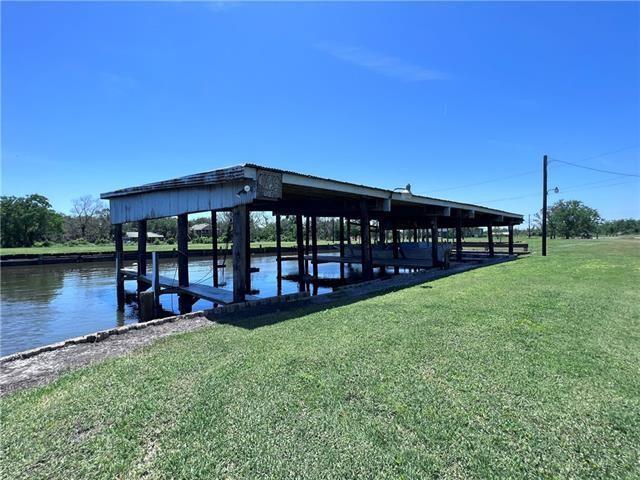 800 Anna St, Lafitte, LA 70067 - dock area with a lawn and a water view