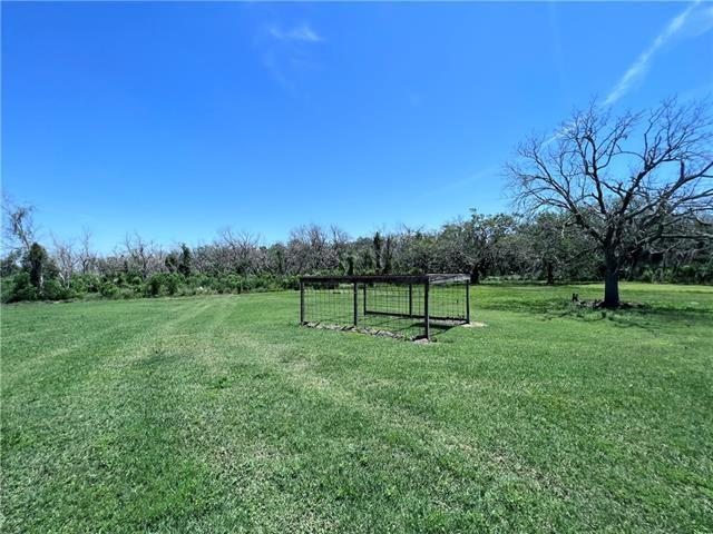 800 Anna St, Lafitte, LA 70067 - view of green lawn featuring a view of countryside
