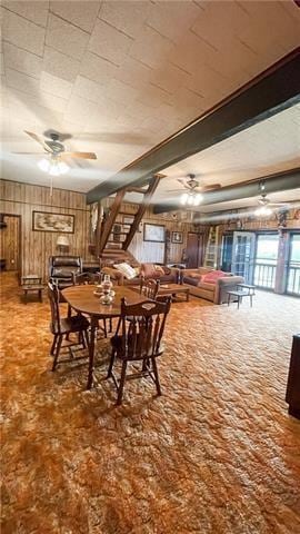 800 Anna St, Lafitte, LA 70067 - dining room with ceiling fan and wood walls