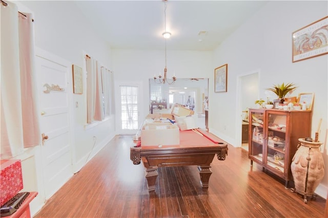 playroom with a notable chandelier, wood-type flooring, and pool table