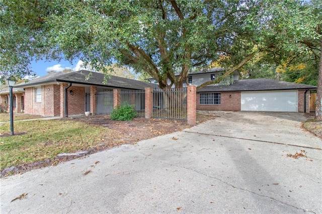 view of front of property with a garage and a front lawn