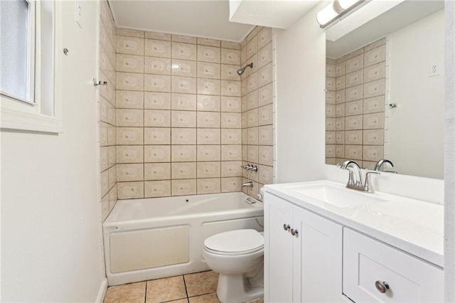 full bathroom with tile patterned floors, vanity, tiled shower / bath combo, and toilet