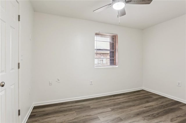 empty room featuring ceiling fan and dark wood-type flooring