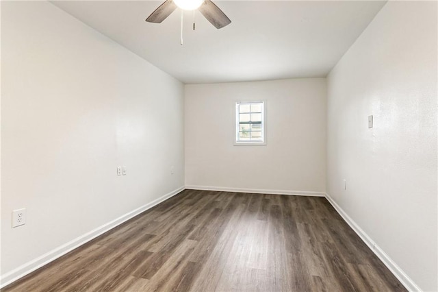 unfurnished room featuring ceiling fan and dark hardwood / wood-style flooring