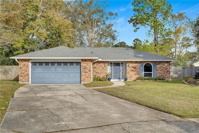 single story home featuring a garage and a front lawn