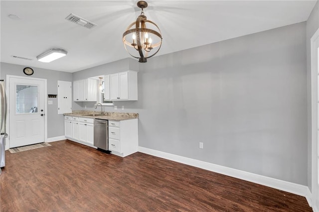 kitchen with stainless steel appliances, dark wood-type flooring, sink, pendant lighting, and white cabinets