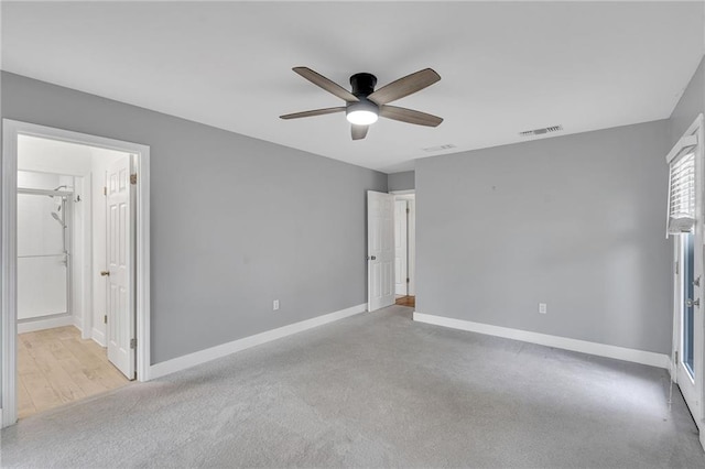 unfurnished bedroom featuring ceiling fan and light colored carpet