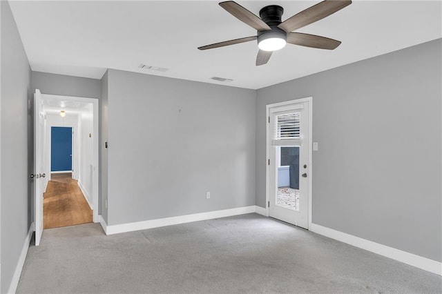 carpeted empty room with ceiling fan