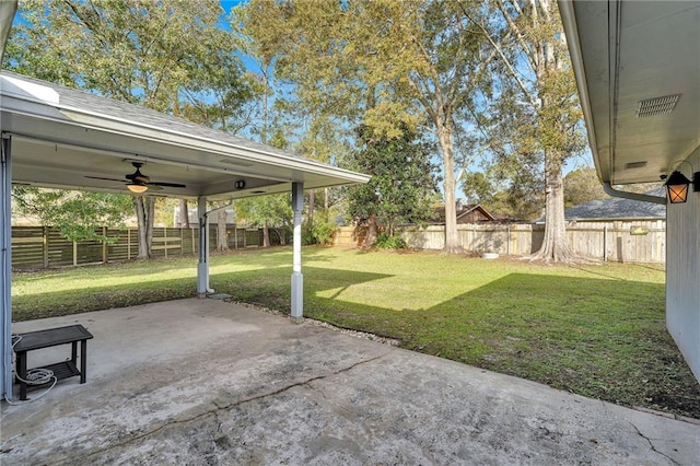 view of yard featuring ceiling fan and a patio area