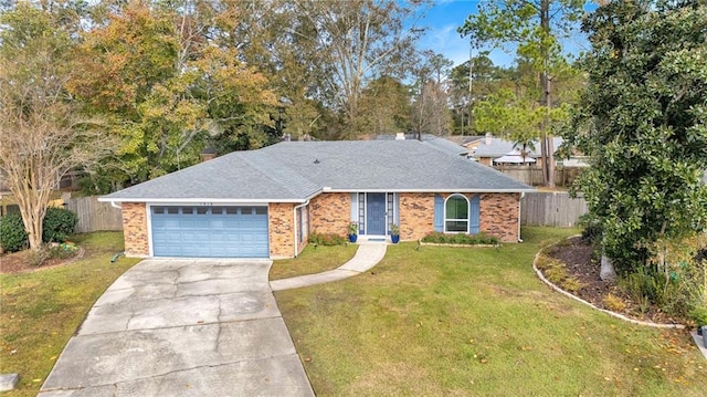 ranch-style home with a garage and a front lawn