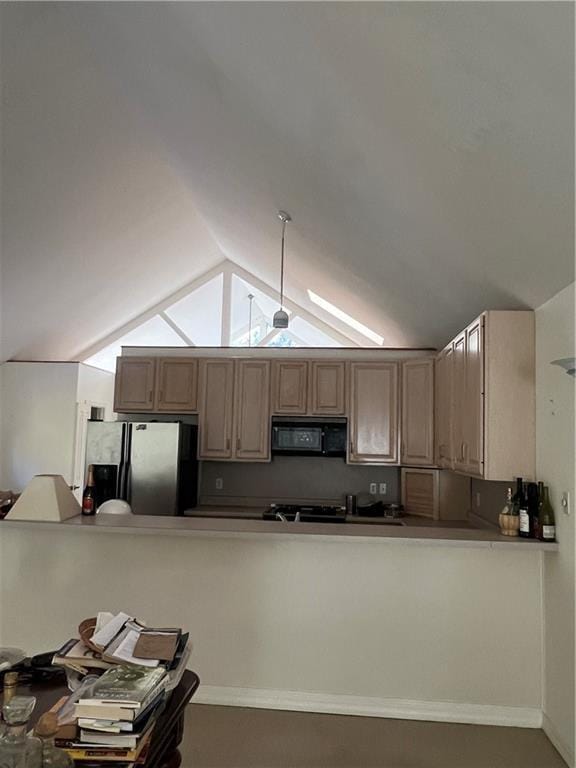 kitchen with stainless steel refrigerator with ice dispenser, ceiling fan, and lofted ceiling