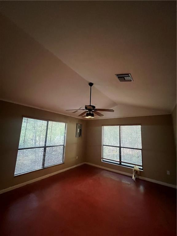 unfurnished room featuring ceiling fan, carpet floors, and lofted ceiling