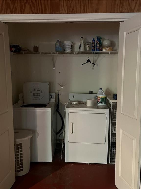 clothes washing area featuring independent washer and dryer