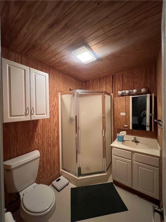 bathroom featuring wood walls, toilet, vanity, wood ceiling, and a shower with shower door