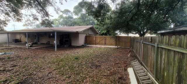 view of yard featuring a patio and central AC unit