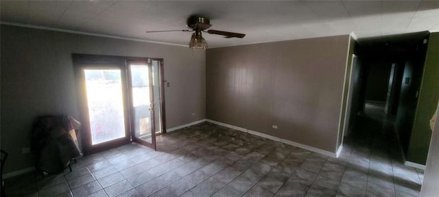 unfurnished room featuring ceiling fan and ornamental molding