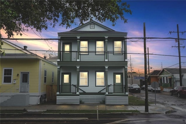 view of front facade with a balcony