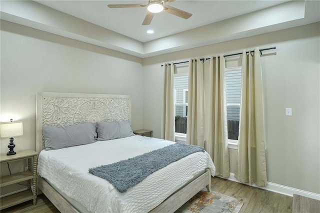 bedroom featuring hardwood / wood-style flooring and ceiling fan