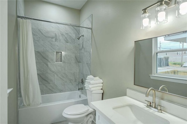 full bathroom with shower / tub combo, vanity, and toilet