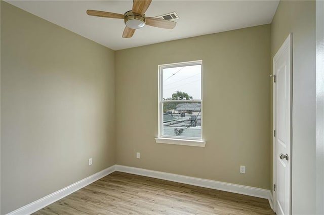 spare room with ceiling fan and light hardwood / wood-style flooring